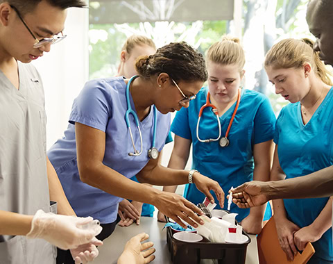 Multi-ethnic group of students in college nursing class