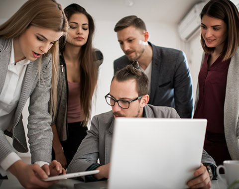 Group of people inside the office of startup company having a meeting regarding their projects