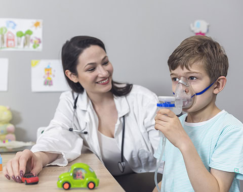Doctor and kid on pediatrician clinic