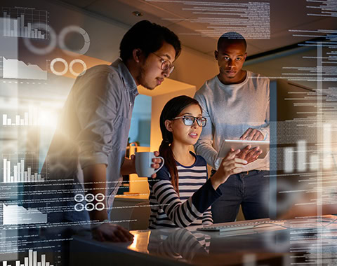 Shot of computer programmers looking through data in the office