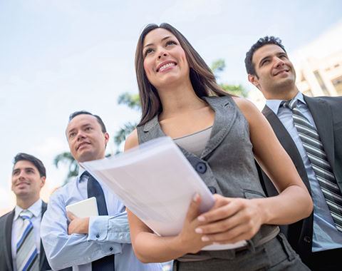 Successful woman leading a business group and looking at the horizon