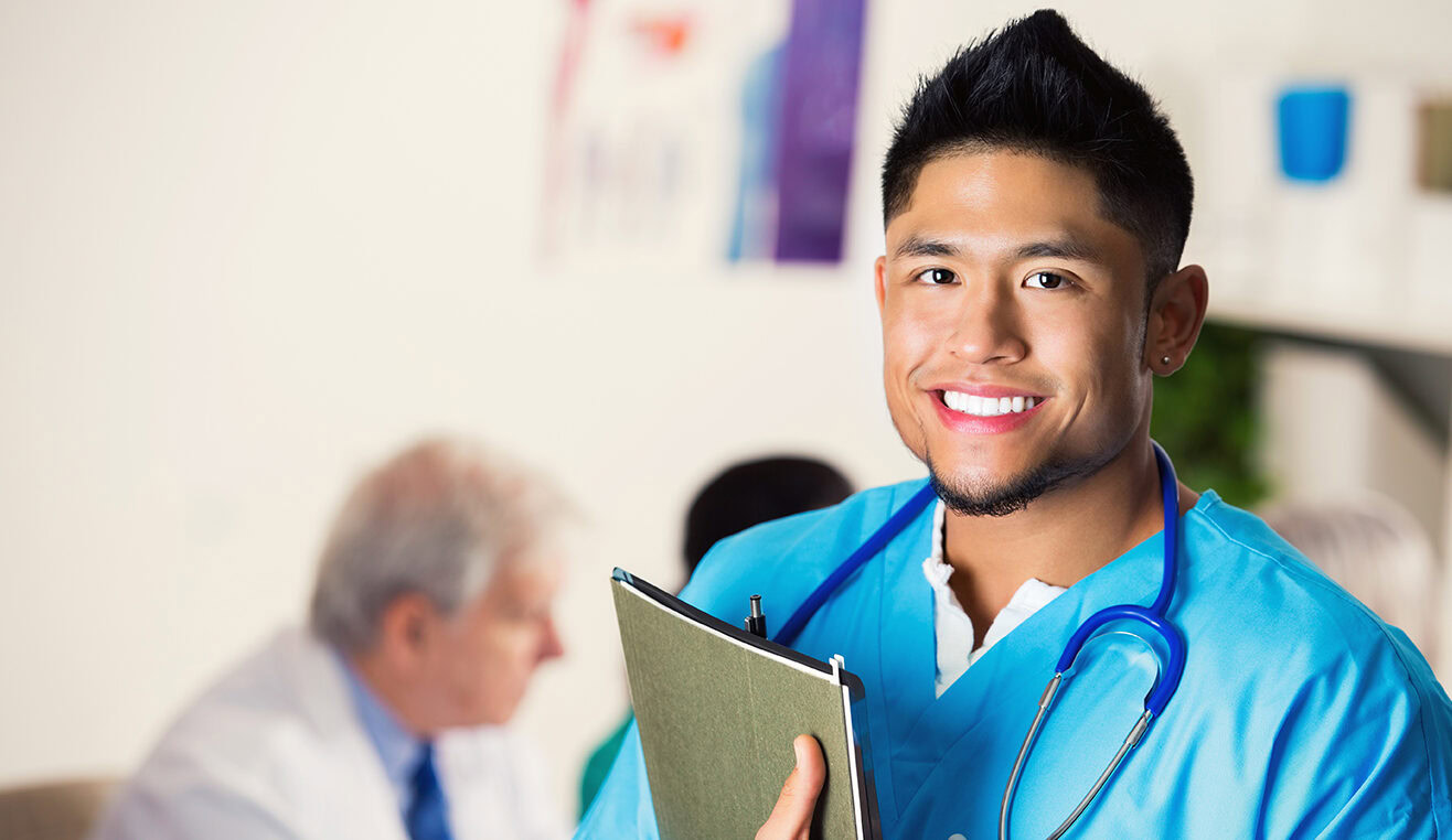 Young adult Asian male nurse or doctor in hospital meeting