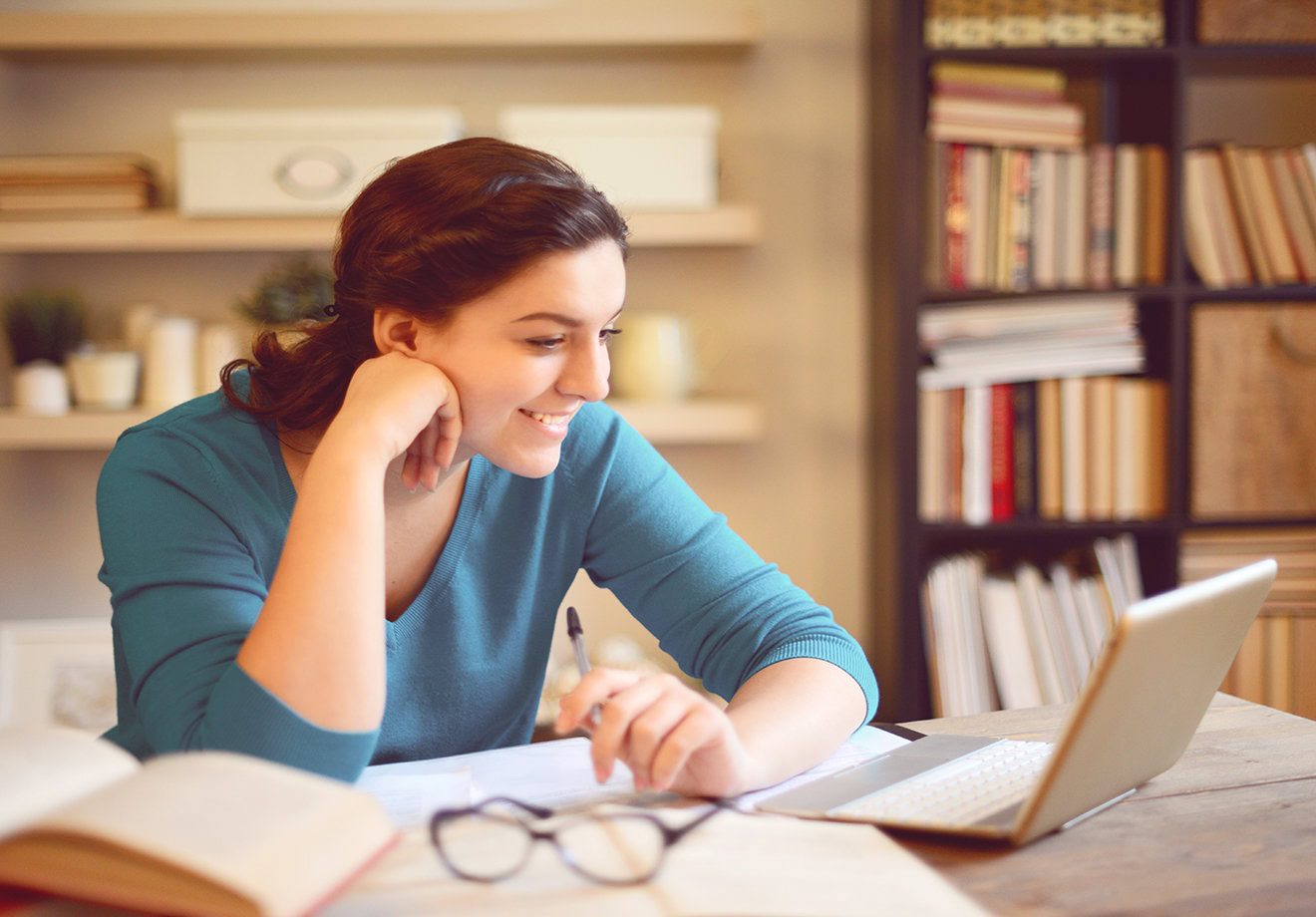 beautiful young woman working at home